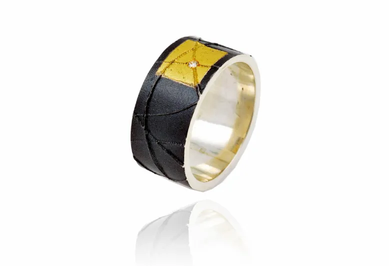 Breiter Silberring mit Gold und Diamamnt