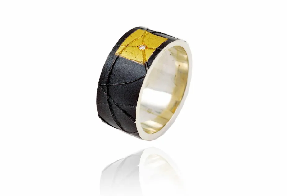 Breiter Silberring mit Gold und Diamamnt