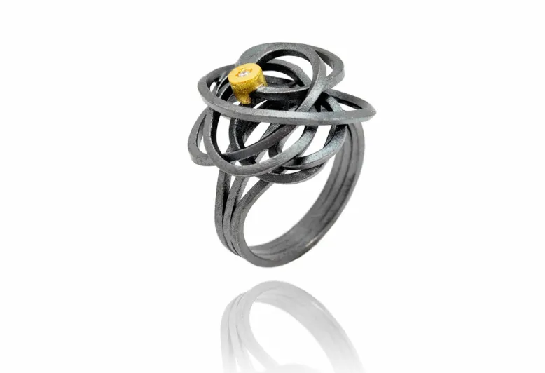 Ring Caos, Silber und Gold und 1 Diamant
