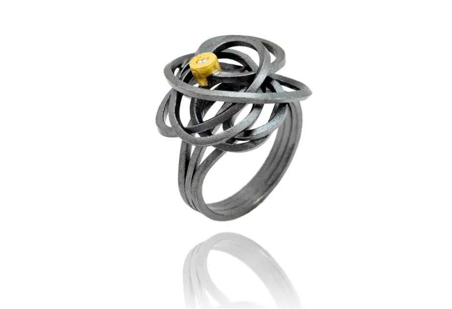 Ring Caos, Silber und Gold und 1 Diamant