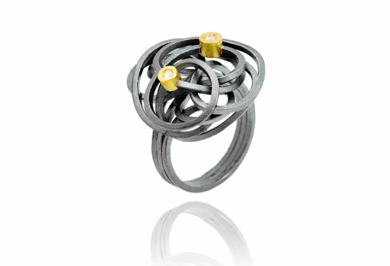 Anillo Caos, plata y oro con 2 diamantes